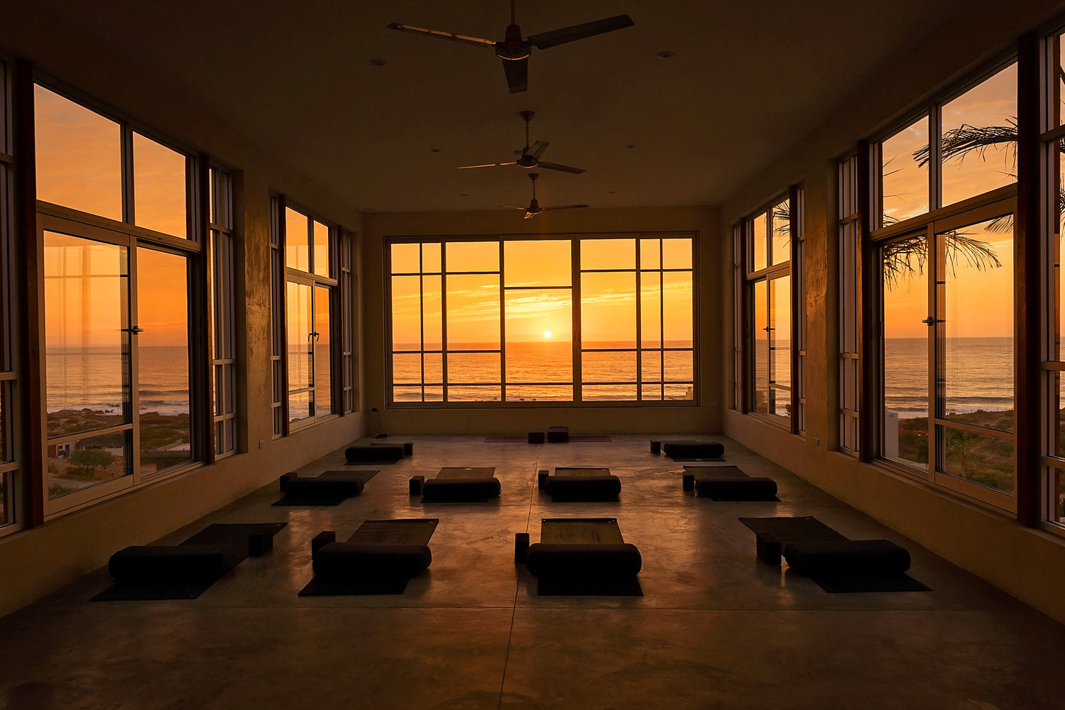 Image of the yoga studio overlooking the ocean during sunset at the soulside spring renewal and recovery yoga retreat in baja california mexico near todos santos.