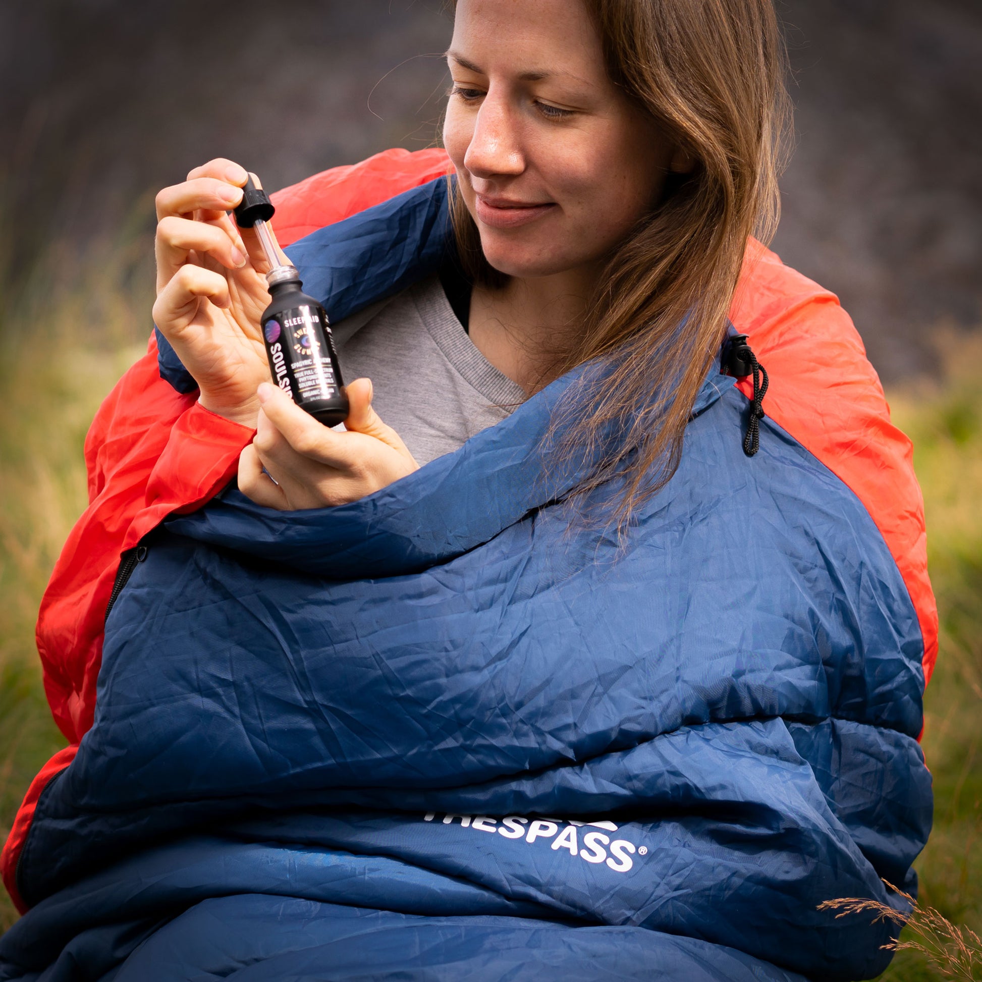 Image of women in sleeping bag using Soulside Sweet Slumber, an organic natural sleep aid that actually works made with premium plants to help you fall asleep and stay asleep.